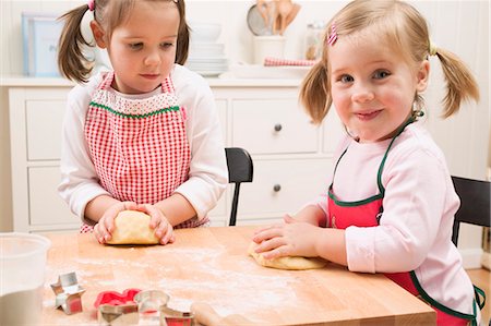 Two small girls kneading dough Stock Photo - Premium Royalty-Free, Code: 659-03526627