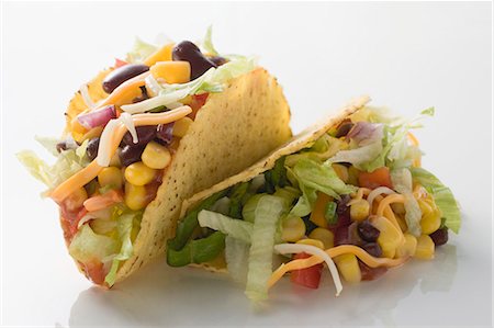 Two tacos filled with sweetcorn and beans Stock Photo - Premium Royalty-Free, Code: 659-03526855