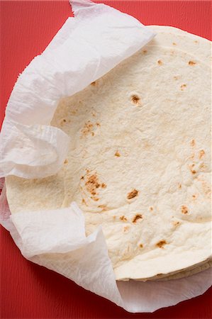 Freshly-baked tortillas on kitchen roll Stock Photo - Premium Royalty-Free, Code: 659-03526860