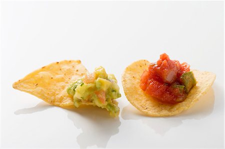 salsa (food) - Guacamole on nacho, salsa on tortilla chip Stock Photo - Premium Royalty-Free, Code: 659-03526903