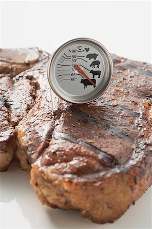 Grilled T-bone steak with meat thermometer Stock Photo - Premium Royalty-Free, Code: 659-03526960