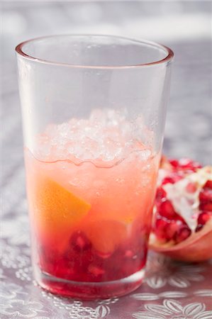 simsearch:659-03523699,k - Fruity drink with orange and pomegranate Foto de stock - Sin royalties Premium, Código: 659-03527198