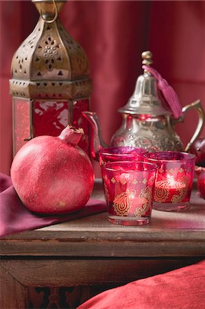 Middle Eastern decorations: pomegranate, windlights, teapot Stock Photo - Premium Royalty-Free, Code: 659-03527193