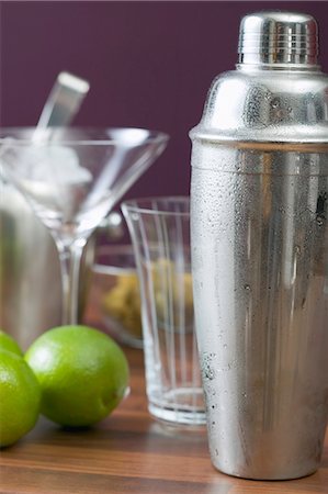 different cocktails - Cocktail shaker, glasses and limes Stock Photo - Premium Royalty-Free, Code: 659-03527267