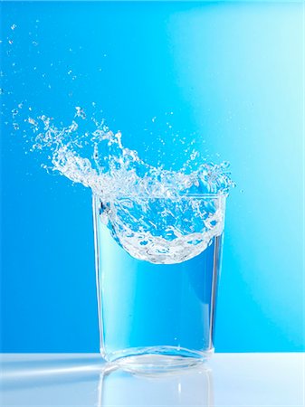 Water splashing out of glass Stock Photo - Premium Royalty-Free, Code: 659-03527344