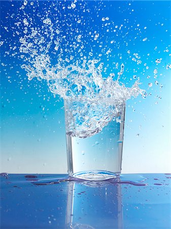 Water splashing out of glass Stock Photo - Premium Royalty-Free, Code: 659-03527345