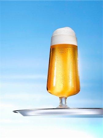 Glass of pils on tray Stock Photo - Premium Royalty-Free, Code: 659-03527534