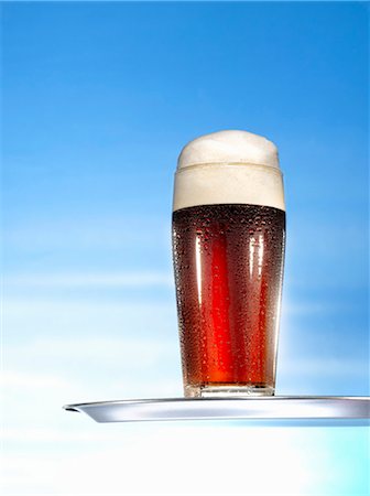 Glass of malt beer on tray Stock Photo - Premium Royalty-Free, Code: 659-03527537