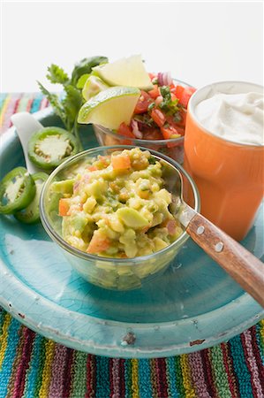 Guacamole, salsa and sour cream on plate (Mexico) Stock Photo - Premium Royalty-Free, Code: 659-03527602