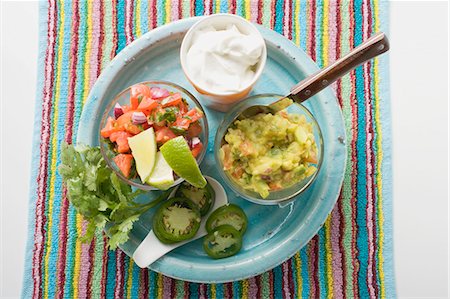 Guacamole, salsa and sour cream on plate (Mexico) Stock Photo - Premium Royalty-Free, Code: 659-03527603