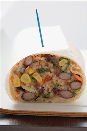 fast food delivery dish - Bean and rice burrito to take away Stock Photo - Premium Royalty-Free, Code: 659-03527615