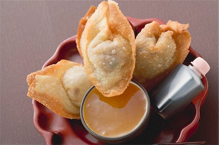 Deep-fried dim sum with two sauces (Asia) Stock Photo - Premium Royalty-Free, Code: 659-03527660