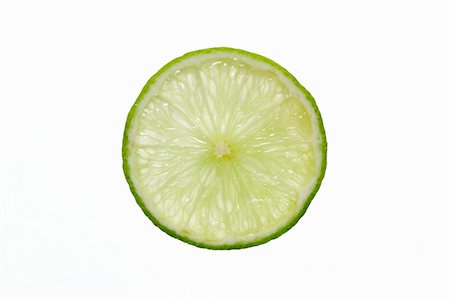 sliced fruits overhead - Slice of lime, backlit Stock Photo - Premium Royalty-Free, Code: 659-03527688