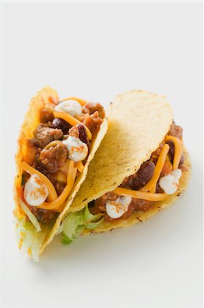 simsearch:659-03528415,k - Tacos filled with mince, cheese and sour cream Stock Photo - Premium Royalty-Free, Code: 659-03527728