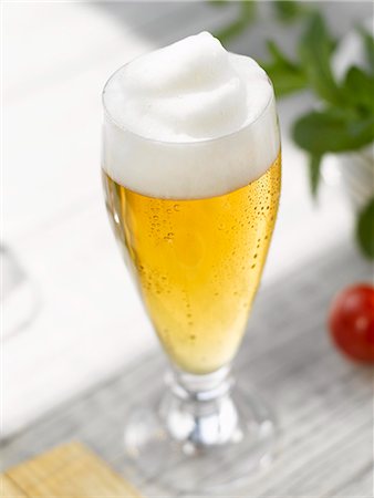 Glass of lager with head of foam Stock Photo - Premium Royalty-Free, Code: 659-03527741