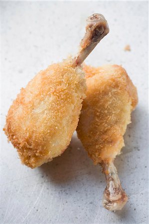 Two breaded chicken legs Foto de stock - Sin royalties Premium, Código: 659-03528179