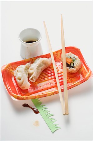 dim sum - Remains of sushi, wontons and soy sauce Stock Photo - Premium Royalty-Free, Code: 659-03528296