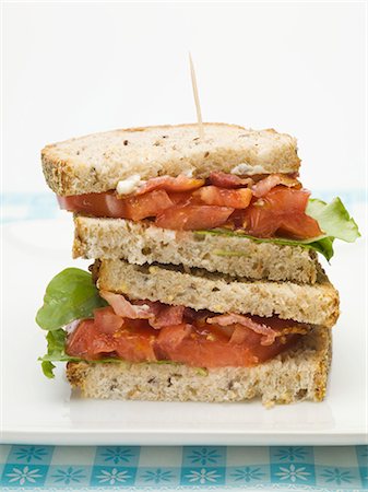 Bacon, lettuce and tomato sandwich, halved and stacked Stock Photo - Premium Royalty-Free, Code: 659-03528423