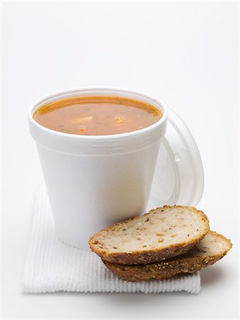 simsearch:659-03528432,k - Tomato & vegetable soup in polystyrene cup, bread beside it Stock Photo - Premium Royalty-Free, Code: 659-03528437