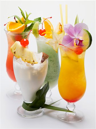 exotic fruity alcoholic drinks - Four different long drinks Stock Photo - Premium Royalty-Free, Code: 659-03528482