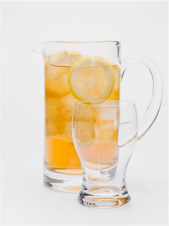 simsearch:659-03528502,k - Iced tea with lemon slices in glass jug Stock Photo - Premium Royalty-Free, Code: 659-03528494