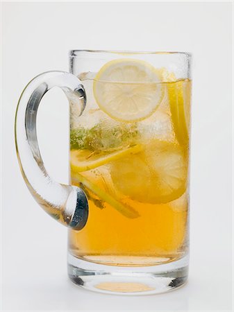 Iced tea with lemon slices in glass jug Stock Photo - Premium Royalty-Free, Code: 659-03528497