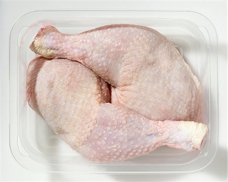 Two chicken legs in plastic container Foto de stock - Sin royalties Premium, Código: 659-03528725