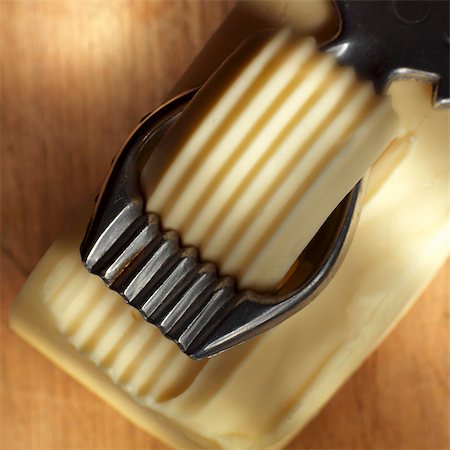 Butter curler making butter curl from block of butter Stock Photo - Premium Royalty-Free, Code: 659-03528830