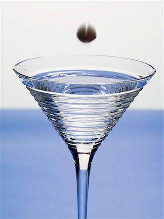 simsearch:659-03529606,k - Olive falling into glass of Martini Stock Photo - Premium Royalty-Free, Code: 659-03528880