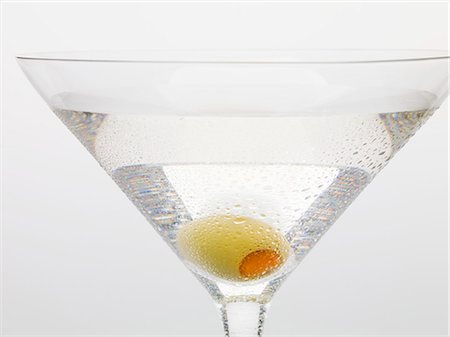 simsearch:659-03529606,k - Martini with green olive (close-up) Stock Photo - Premium Royalty-Free, Code: 659-03528933