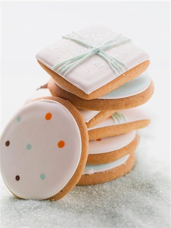 decorated cookie - Assorted iced biscuits on blue sugar Stock Photo - Premium Royalty-Free, Code: 659-03528963