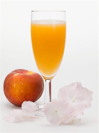 simsearch:659-06187716,k - Peach and sparkling wine cocktail Stock Photo - Premium Royalty-Free, Code: 659-03529108