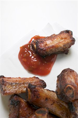 simsearch:659-06186388,k - Roasted pork ribs with dip Stock Photo - Premium Royalty-Free, Code: 659-03529137