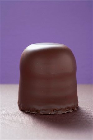 A chocolate-coated marshmallow treat Stock Photo - Premium Royalty-Free, Code: 659-03529364