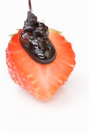 simsearch:659-06900815,k - Half a strawberry with chocolate sauce Stock Photo - Premium Royalty-Free, Code: 659-03529432