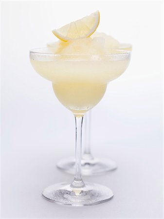 simsearch:659-03529590,k - Two Frozen Lemon Margaritas Stock Photo - Premium Royalty-Free, Code: 659-03529444
