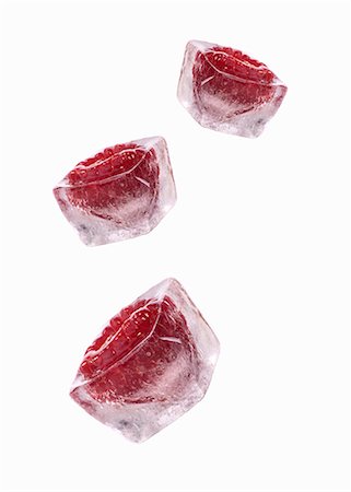 fruit icecubes - Three raspberry ice cubes Stock Photo - Premium Royalty-Free, Code: 659-03529544