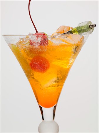 Tequila Sunrise with ice cubes and cocktail cherries Stock Photo - Premium Royalty-Free, Code: 659-03529585