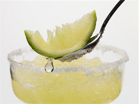 fruit sherbet - Frozen Margarita, lime wedge on spoon Stock Photo - Premium Royalty-Free, Code: 659-03529590