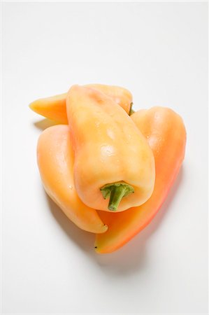 simsearch:659-08513249,k - Four yellow pointed peppers Stock Photo - Premium Royalty-Free, Code: 659-03529618