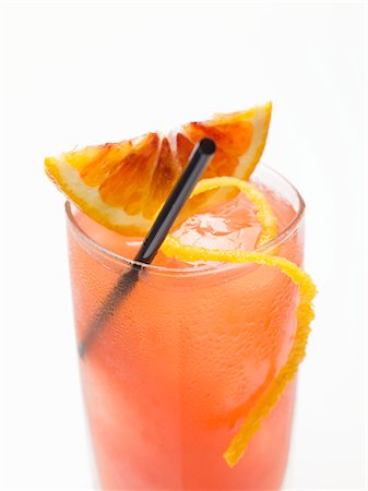 Blood orange drink with ice cubes Stock Photo - Premium Royalty-Free, Code: 659-03529641