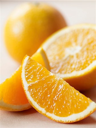 Fresh Oranges; Wedges, Half and Whole Stock Photo - Premium Royalty-Free, Code: 659-03520957