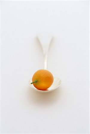 simsearch:659-03534657,k - A kumquat on a spoon Stock Photo - Premium Royalty-Free, Code: 659-03521042
