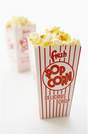 Carton of Buttered Popcorn Stock Photo - Premium Royalty-Free, Code: 659-03521126