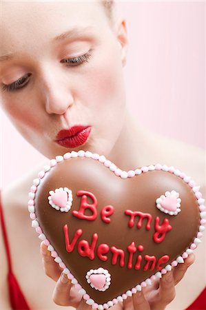 person food label - Young woman holding a chocolate heart for Valentine's Day Stock Photo - Premium Royalty-Free, Code: 659-03521783