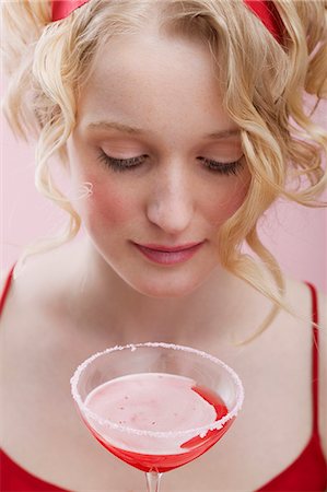 Young woman with Cosmopolitan Stock Photo - Premium Royalty-Free, Code: 659-03521793