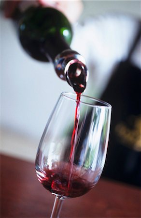 Pouring red wine Stock Photo - Premium Royalty-Free, Code: 659-03521822