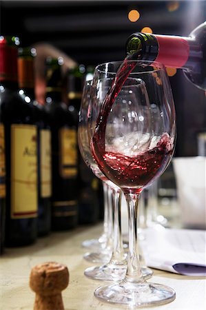 Pouring red wine Stock Photo - Premium Royalty-Free, Code: 659-03521907