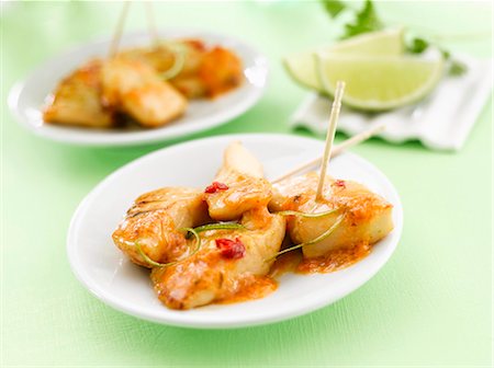 Caramelised chicken with lime (green background) Foto de stock - Sin royalties Premium, Código: 659-03521913