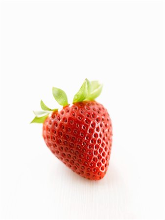 simsearch:659-07028243,k - One strawberry on white wooden surface Stock Photo - Premium Royalty-Free, Code: 659-03521925